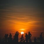 silhouette-of-a-group-of-people-at-sunrise-2024-05-31-00-24-42-utc